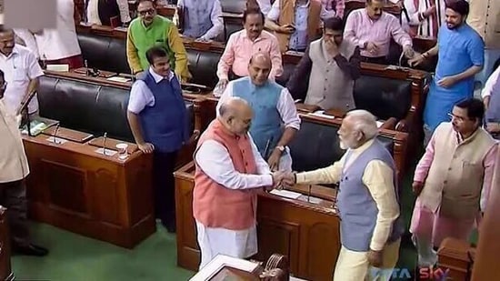 Prime Minister Narendra Modi congratulating Home Minister Amit Shah on abrogation of Article 370 in 2019.